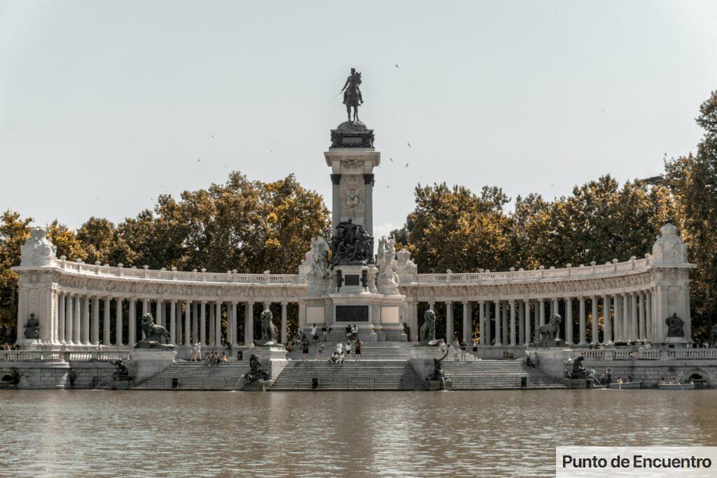 black statue near water during daytime